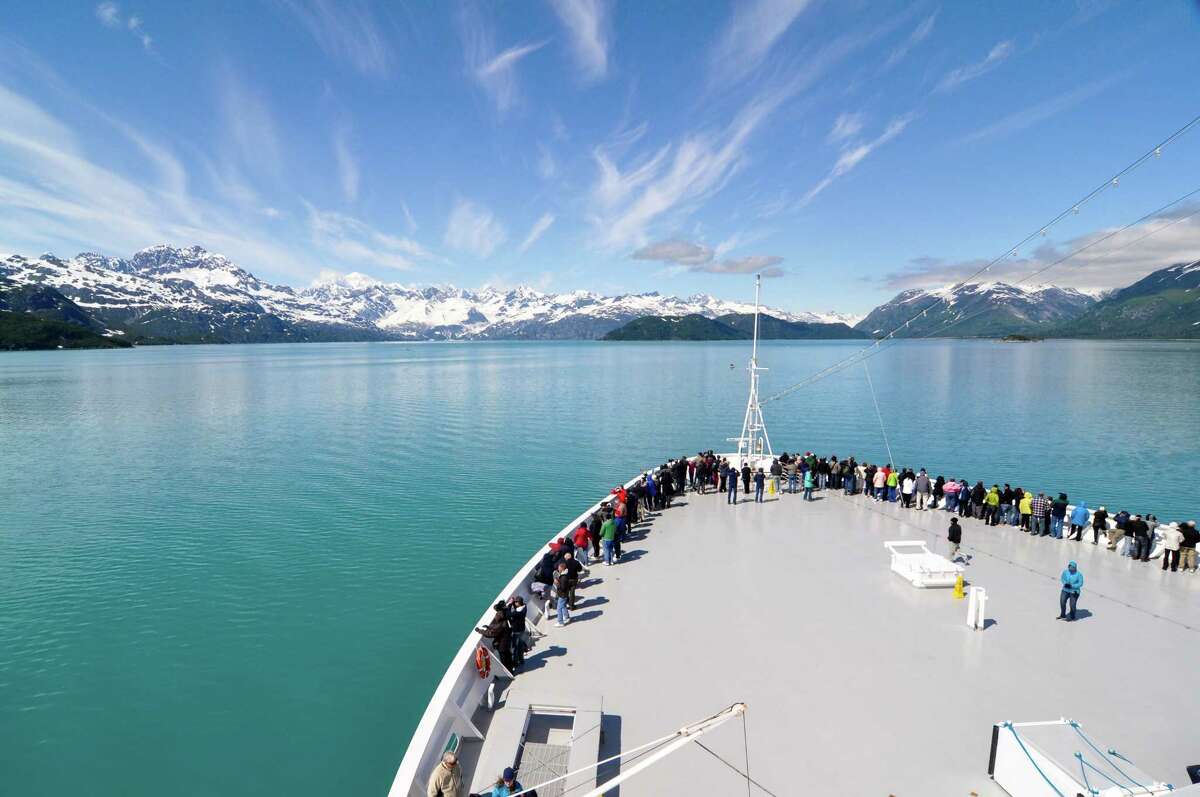 ﻿Holland America Line's MS Zaandam enjoys smooth sailing on a sunny day cruising through Glacier Bay National Park in Alaska.
