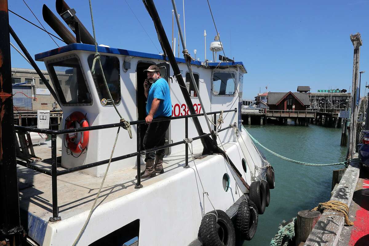 Joe Pennisi, on his fishing trawler F/V Pioneer on Fisherman’s Wharf, favors being allowed to sell fish wholesale from his boat.