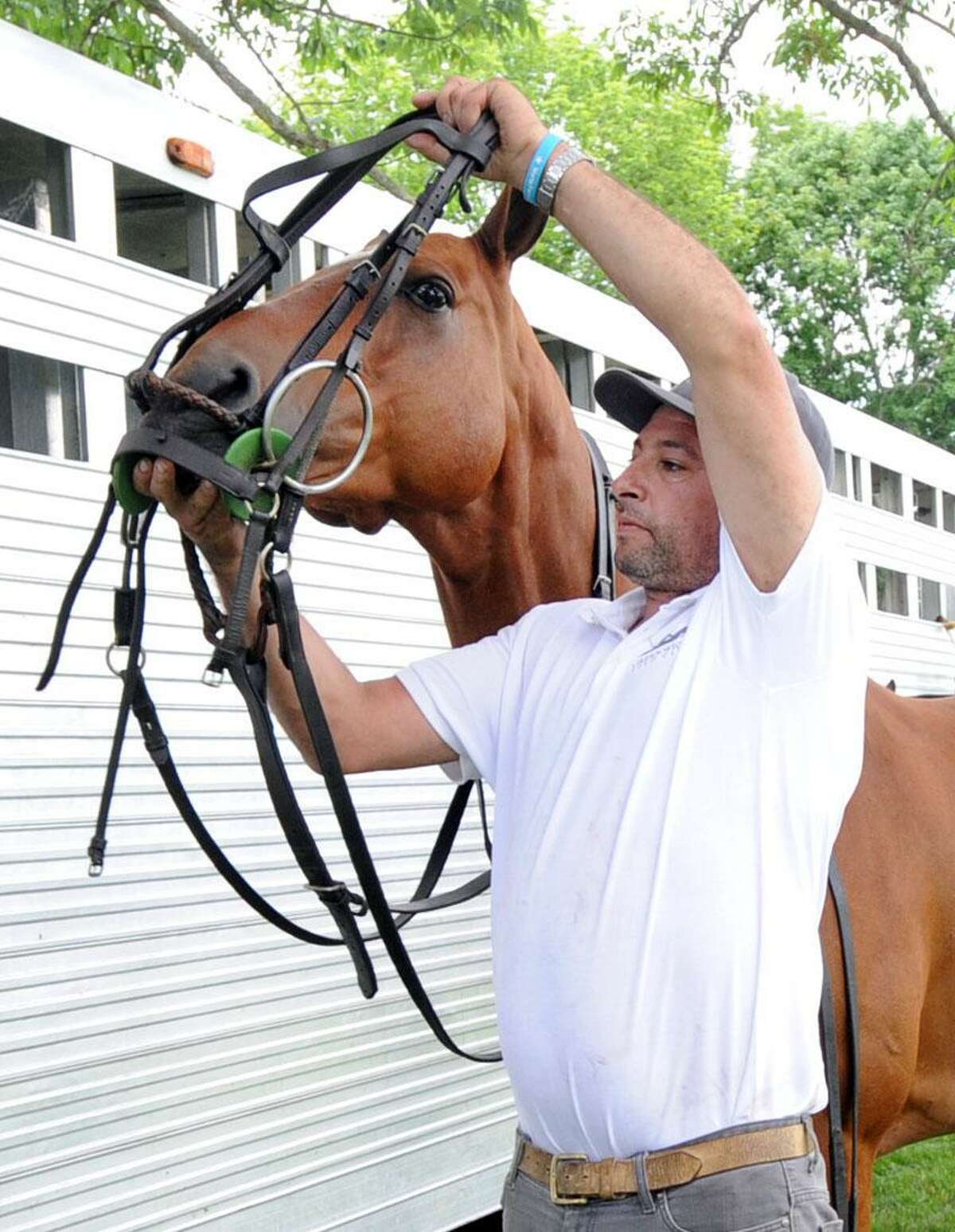 Juan Nicora, a groom, prepares Chimango, the horse of polo player Nick Manifold at the Greenwich Polo Club in Greenwich, Conn., Thursday, June 1, 2017. Mariana Castro, the director of marketing for the Greenwich Polo Club said the first match of the season is scheduled for Sunday, June 4th. Castro said the gates open at 1 p.m.(match starts at 3 p.m.) and that all are welcome. There is an entrance fee of $40 per vehicle which includes the match and parking. The Greenwich Polo Club is located off upper North Street in Greenwich, the cross street entrance is 1 Hurlingham Drive.