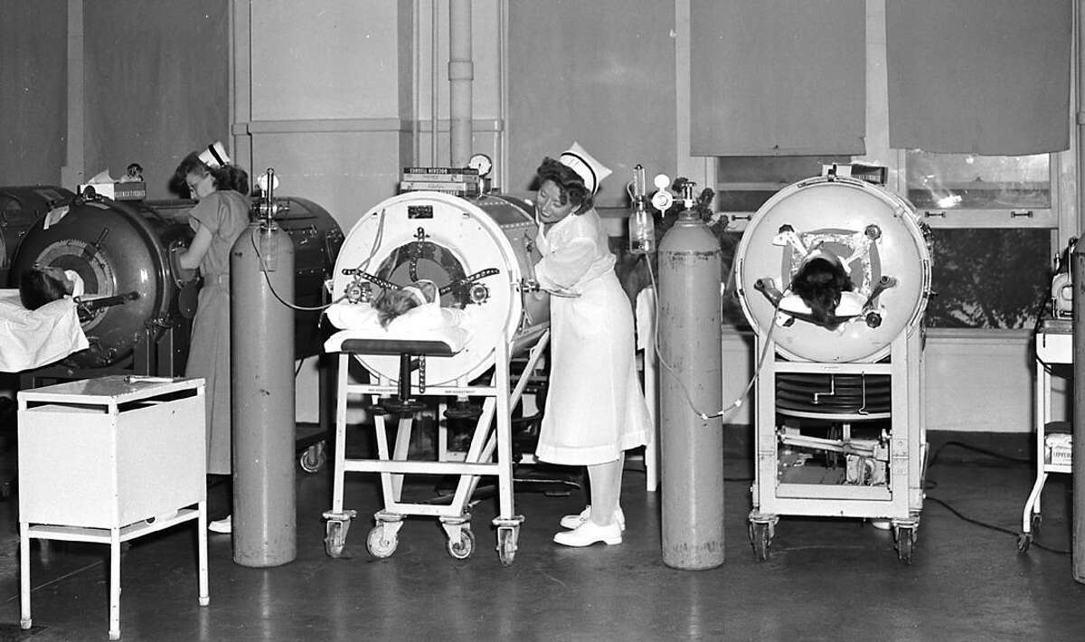 Nurses tended to polio patients in iron lung respirators at the Robert B. Green Memorial Hospital polio ward in San Antonio in 1950. It was a common scene throughout the polio crisis that swept Texas.