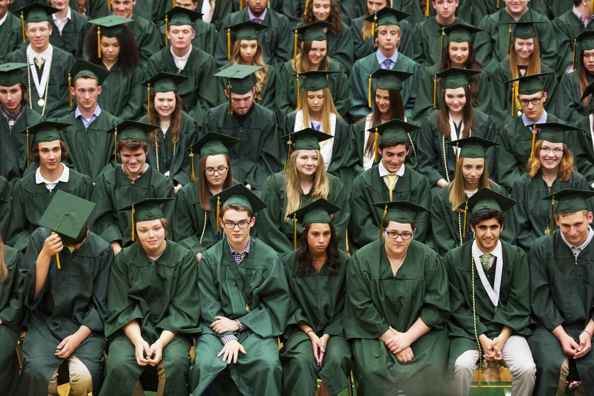 Dow High School students reacts while listening to student Ben Price, not pictured, speak during commencement on Friday.