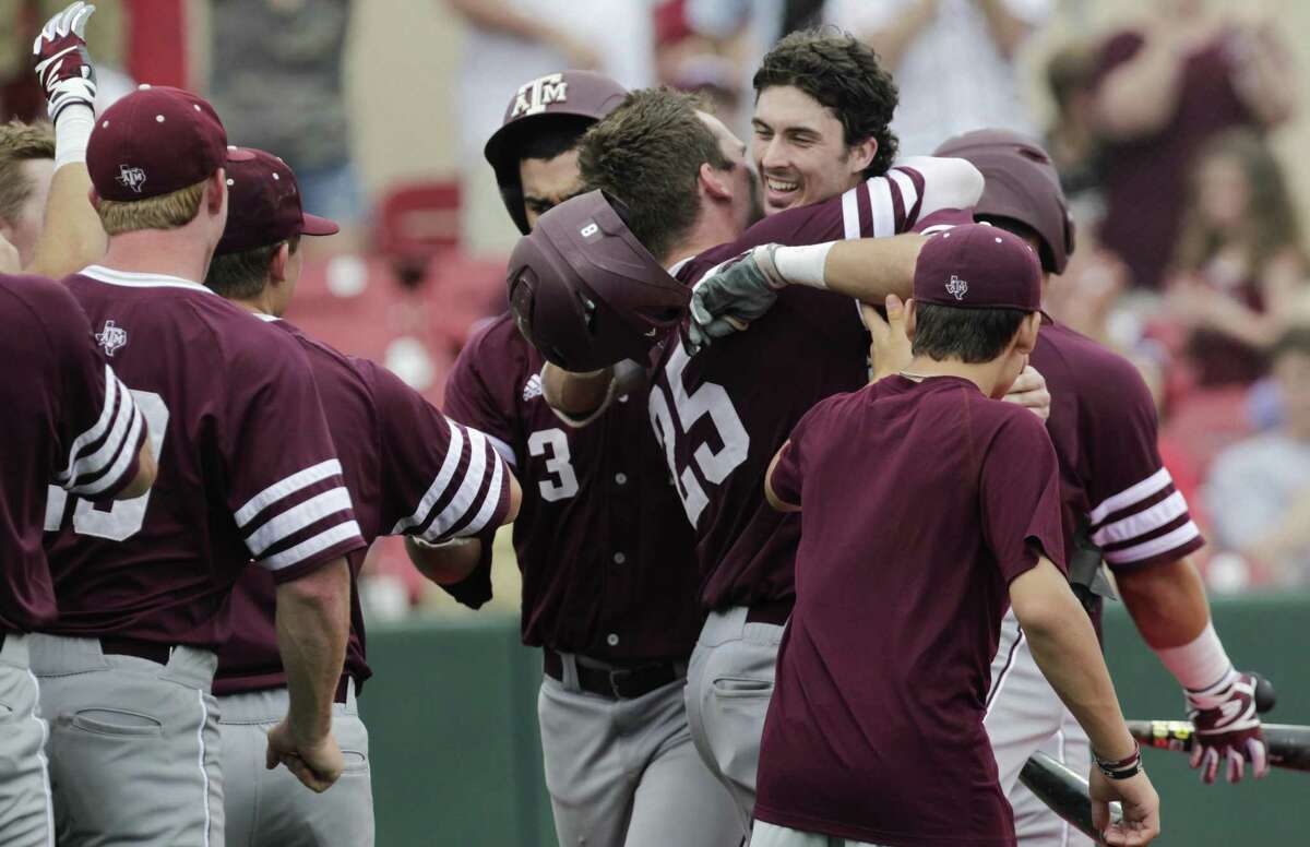 Texas A&M players come out to celebrate Braden Shewmake's (8) two-run homerun during the 2017 NCAA Regional game at Darryl and Lori Schroeder Park Friday, June 2, 2017, in Houston. ( Yi-Chin Lee / Houston Chronicle )
