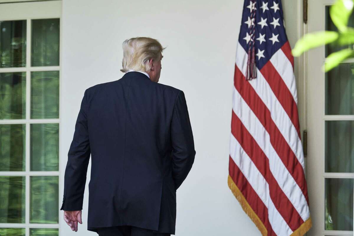 President Donald Trump exits following an announcement that the U.S. would withdraw from the Paris climate pact and that he will seek to renegotiate the international agreement. (T.J. Kirkpatrick/Bloomberg)