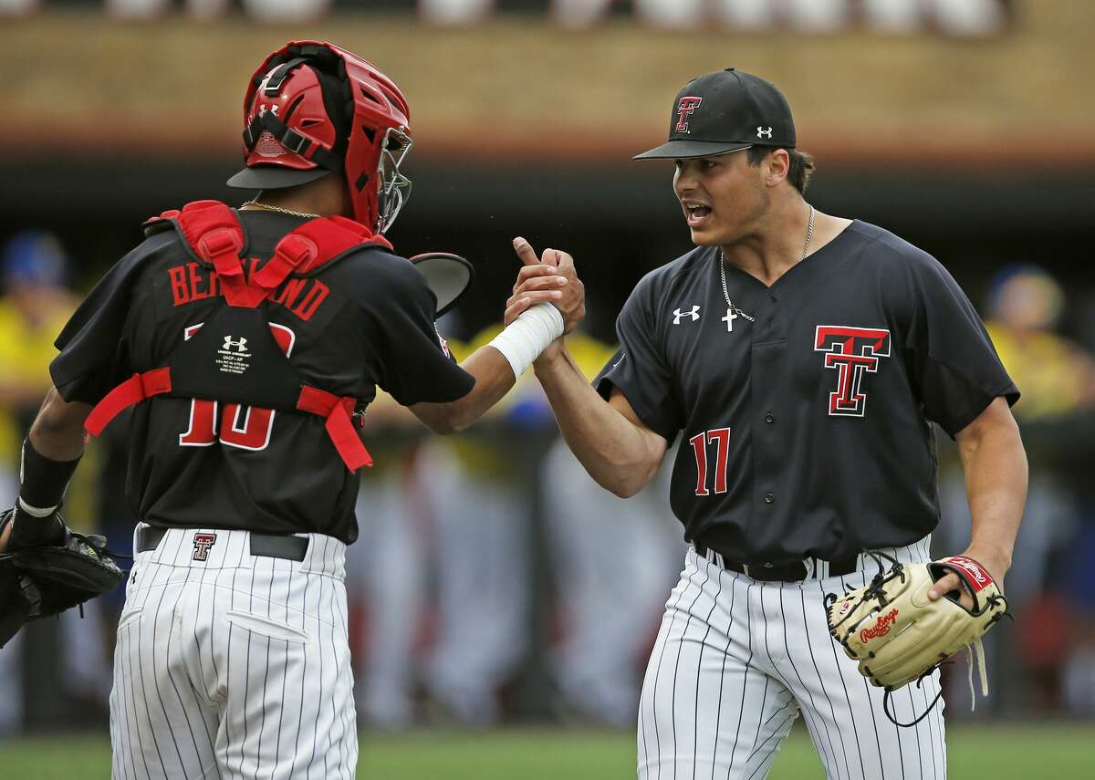 Texas Tech's John McMillon (17) celebrates with Michael Berglund after finishing the sixth inning against Delaware during an NCAA college baseball tournament regional game, Friday, June 2, 2017, in Lubbock, Texas. (Brad Tollefson/Lubbock Avalanche-Journal via AP)