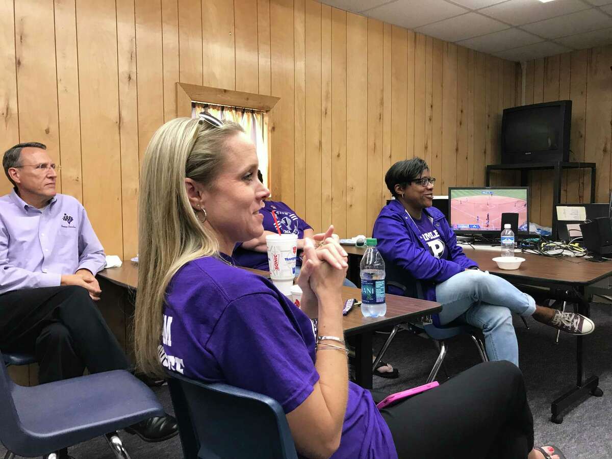 Kameron Wilder, Dr. Timothy Walsh, and Calandra Lewis joined the Willis ISD faculty and staff rooted for the Ladykats from campus during the state semifinals game against Dripping Springs Friday.