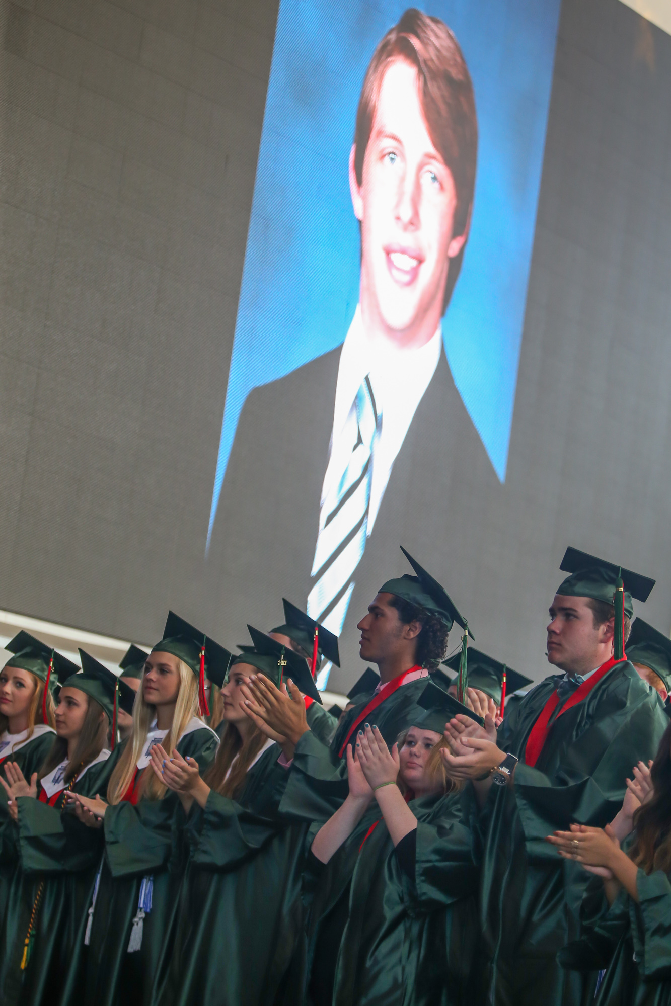 The Woodlands High School graduates rise for Grant Milton