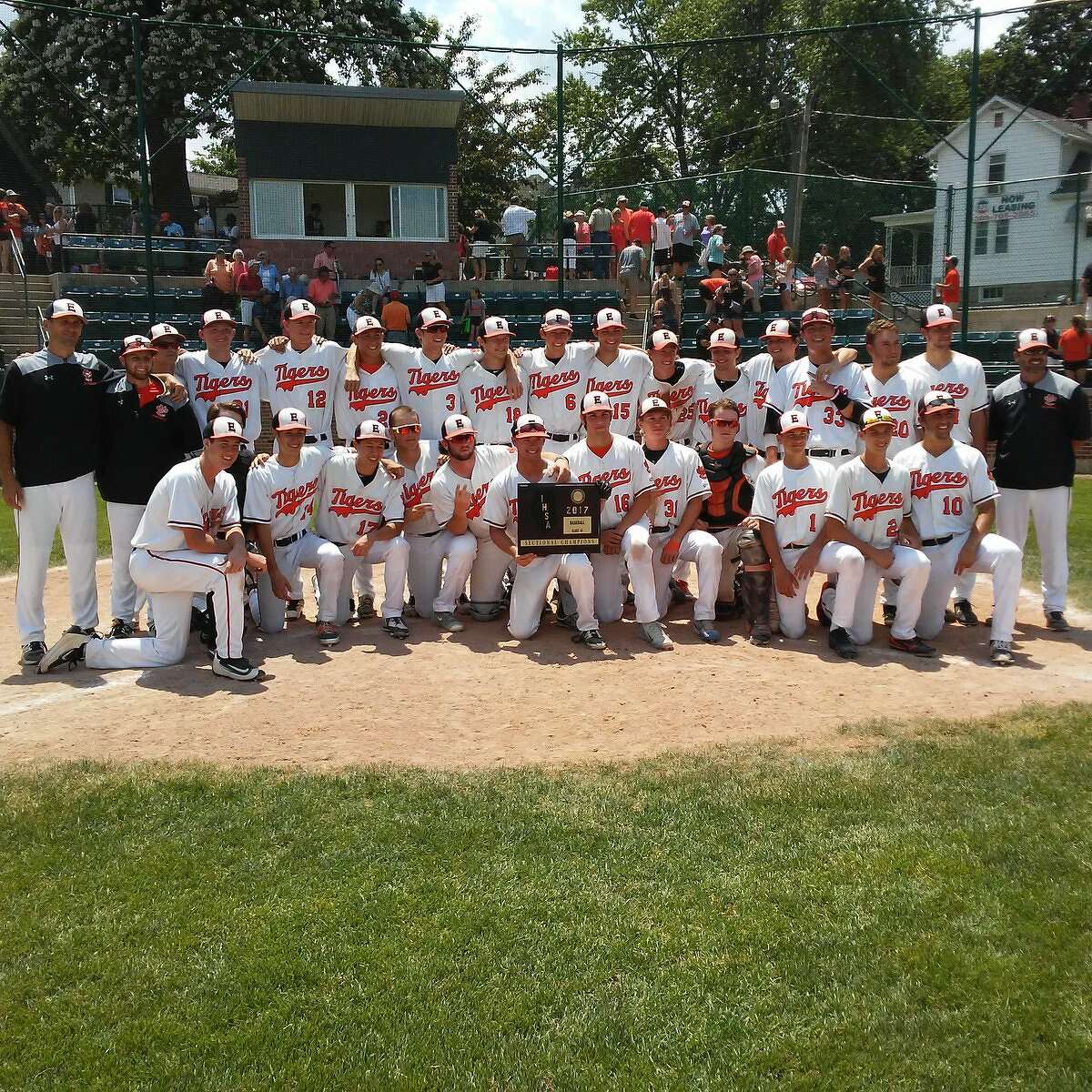 The Edwardsville Tigers pose with the championship plaque after beating Normal West on Saturday in the title game of the Class 4A Bloomington (Illinois Wesleyan) Sectional.