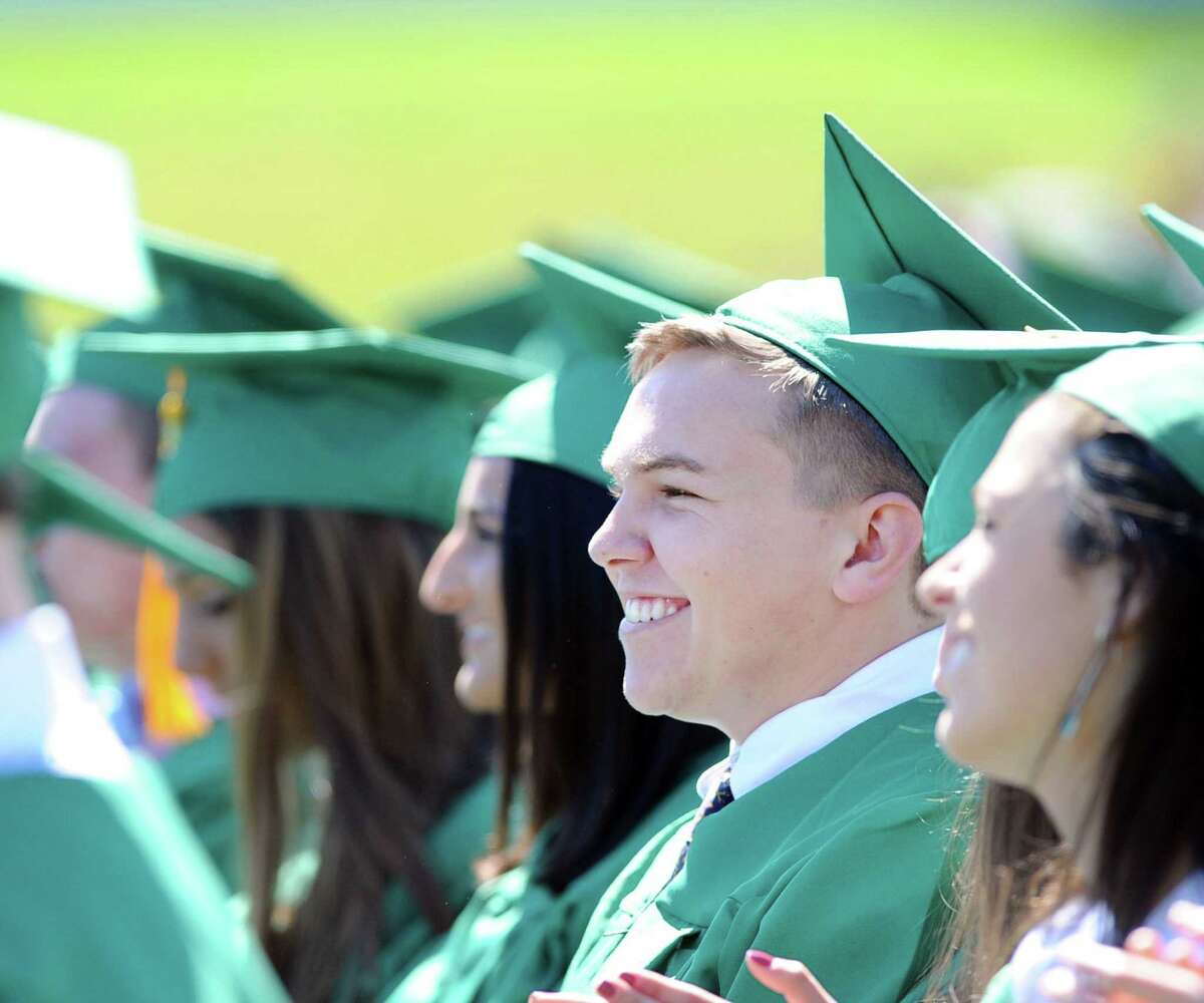 Jeffrey DeRosa, 18, of Norwalk, smiles during his Trinity Catholic High School commencement at the school in Stamford, Conn., Saturday, June 3, 2017.