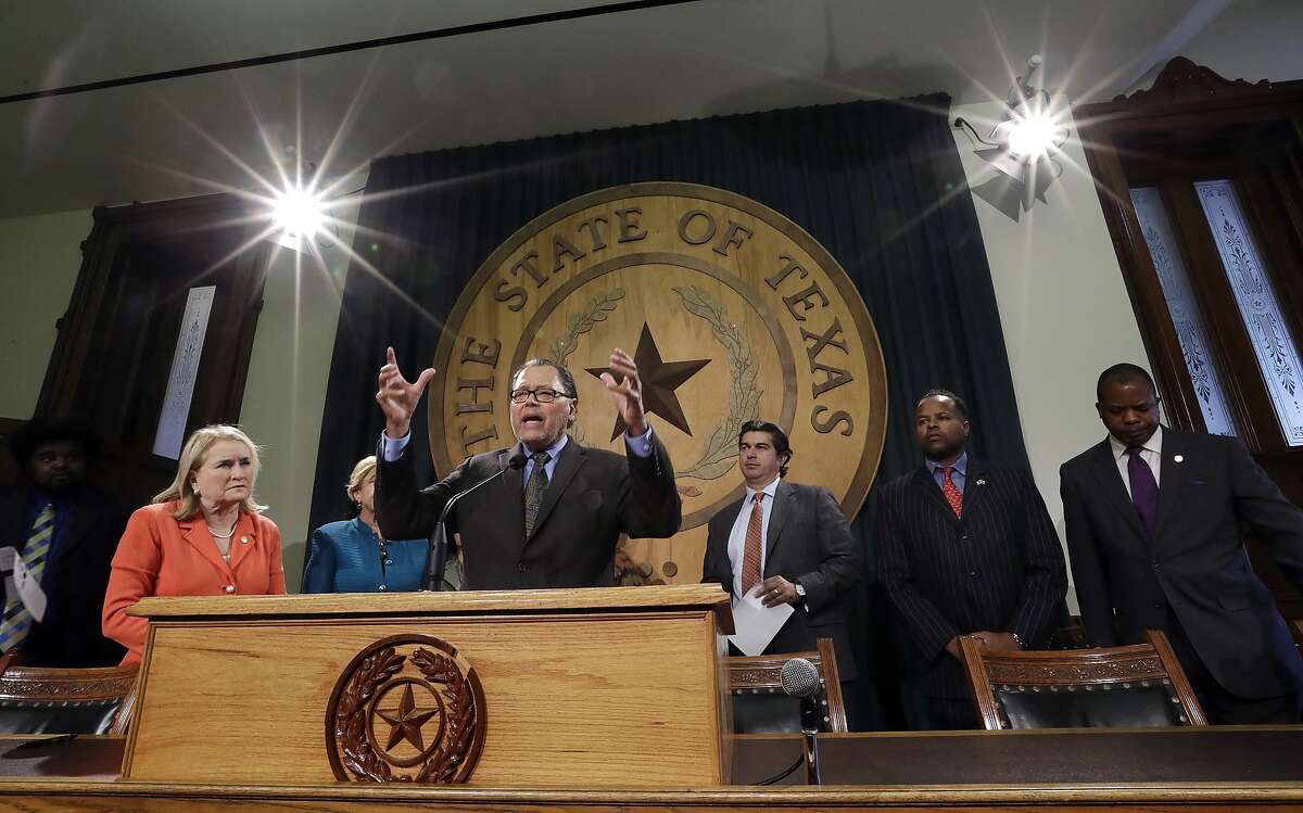 Sen. Jose Rodriguez, D-El Paso, center, stands with other Texas legislators and civil rights representatives during a news conference at the Texas Capitol, Monday, Jan. 9, 2017, in Austin, Texas. Rodriguez and the group called for Texas Gov. Greg Abbott and other legislators to protect the rights of minorities and immigrants as the Texas' 85th Legislative session begins Tuesday. (AP Photo/Eric Gay)