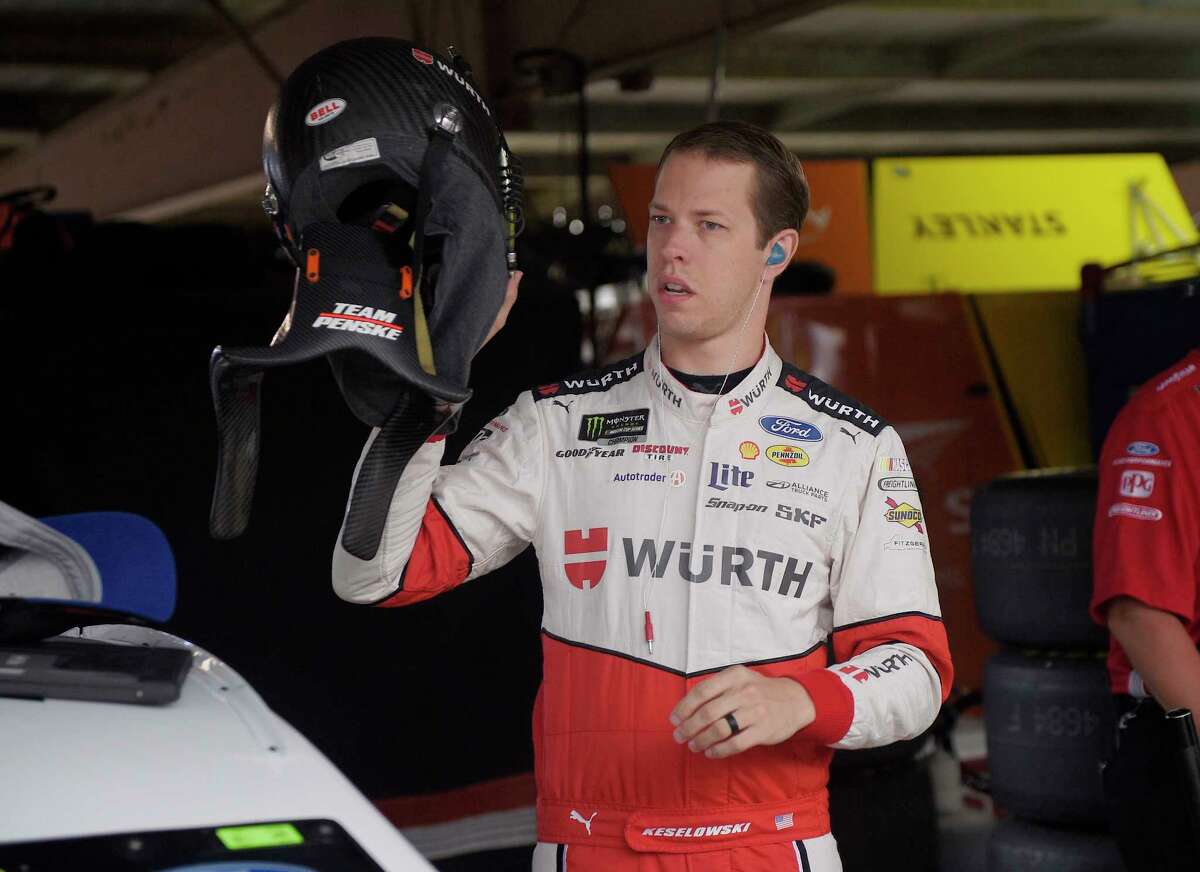 Brad Keselowski gets ready before practice for the NASCAR Cup series auto race, Saturday, June 3, 2017, at Dover International Speedway in Dover, Del. (AP Photo/Nick Wass)
