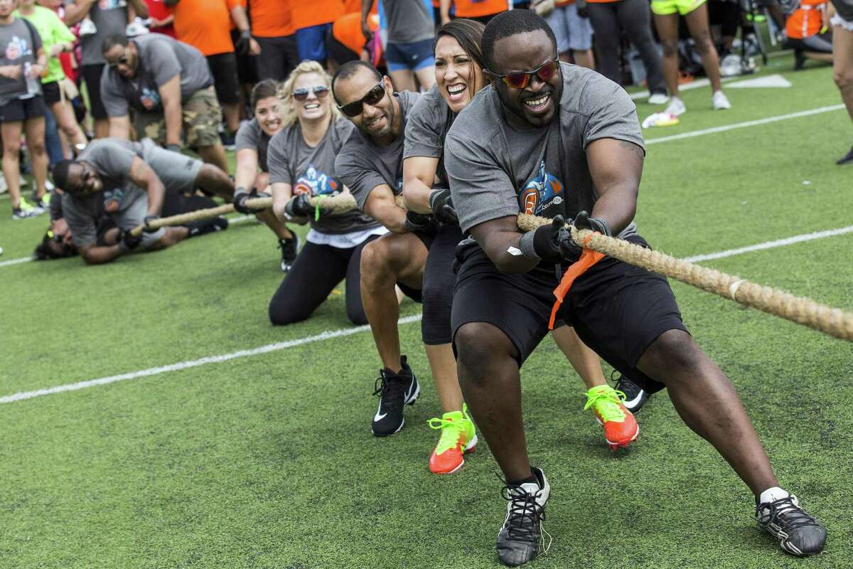 Todd Hamilton of Capture RX leads his team in tug-of-war during the San Antonio Sports Corporate Cup at the University of the Incarnate Word in San Antonio, Texas on June 3, 2017. Ray Whitehouse / for the San Antonio Express-News