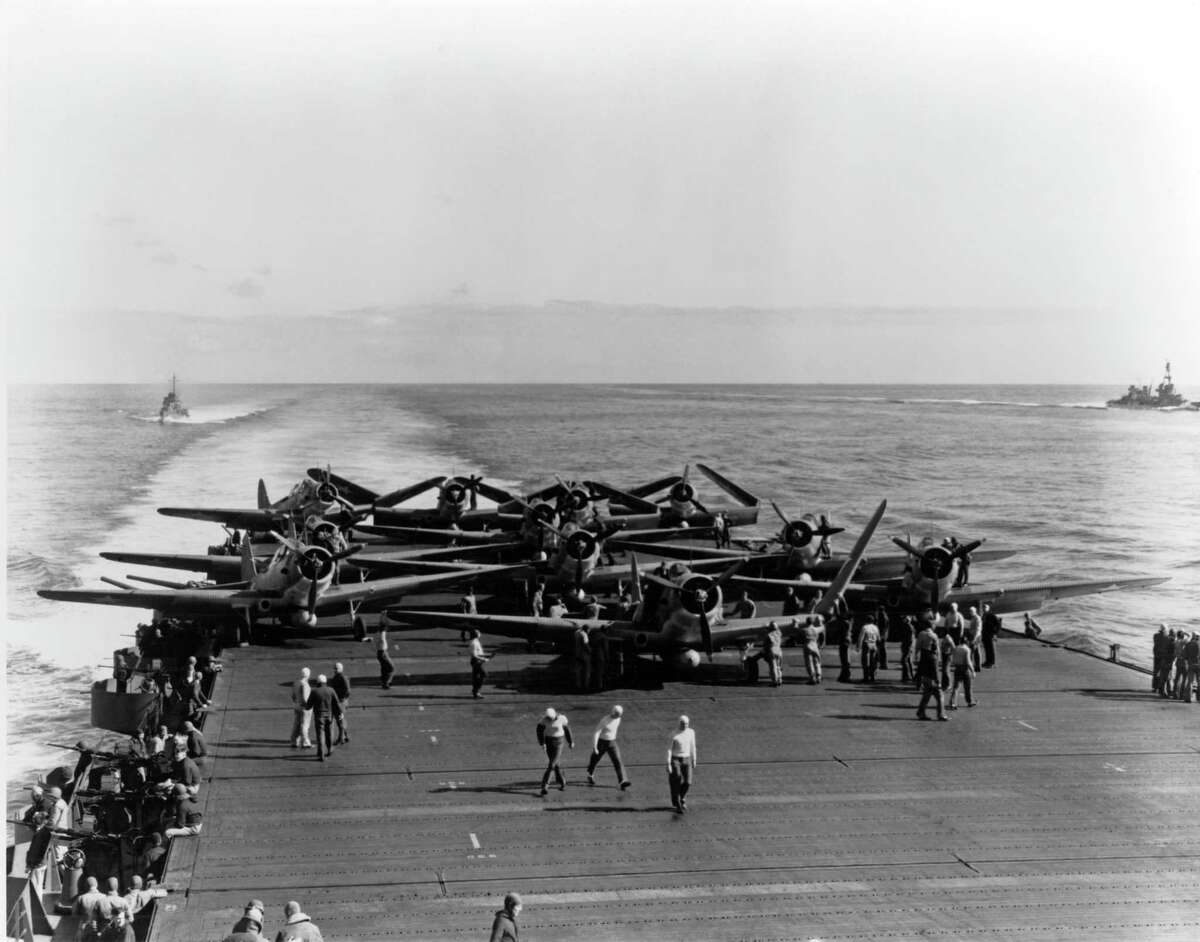In this June 4, 1942 photo provided by the U.S. Navy, Torpedo Squadron Six aircraft are prepared for launching on USS Enterprise during the Battle of Midway in the Pacific Ocean. Buffalo, New York native C. Wade McClusky Jr. will have a statue of his likeness included in a new military monument being dedicated June 4, 2017, the 75th anniversary of the Battle of Midway. (United States Navy via AP)