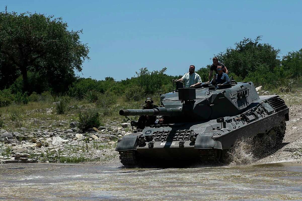 DriveTanks.com customers drive the German Leopard 1A4 Tank through the tank course at Ox Ranch Wednesday, May 24, 2017 in Uvalde. At the ranch, people can drive and shoot the main canon of vintage WWII-era tanks and fire a variety of machine guns, artillery and other heavy guns. ( Michael Ciaglo / Houston Chronicle )