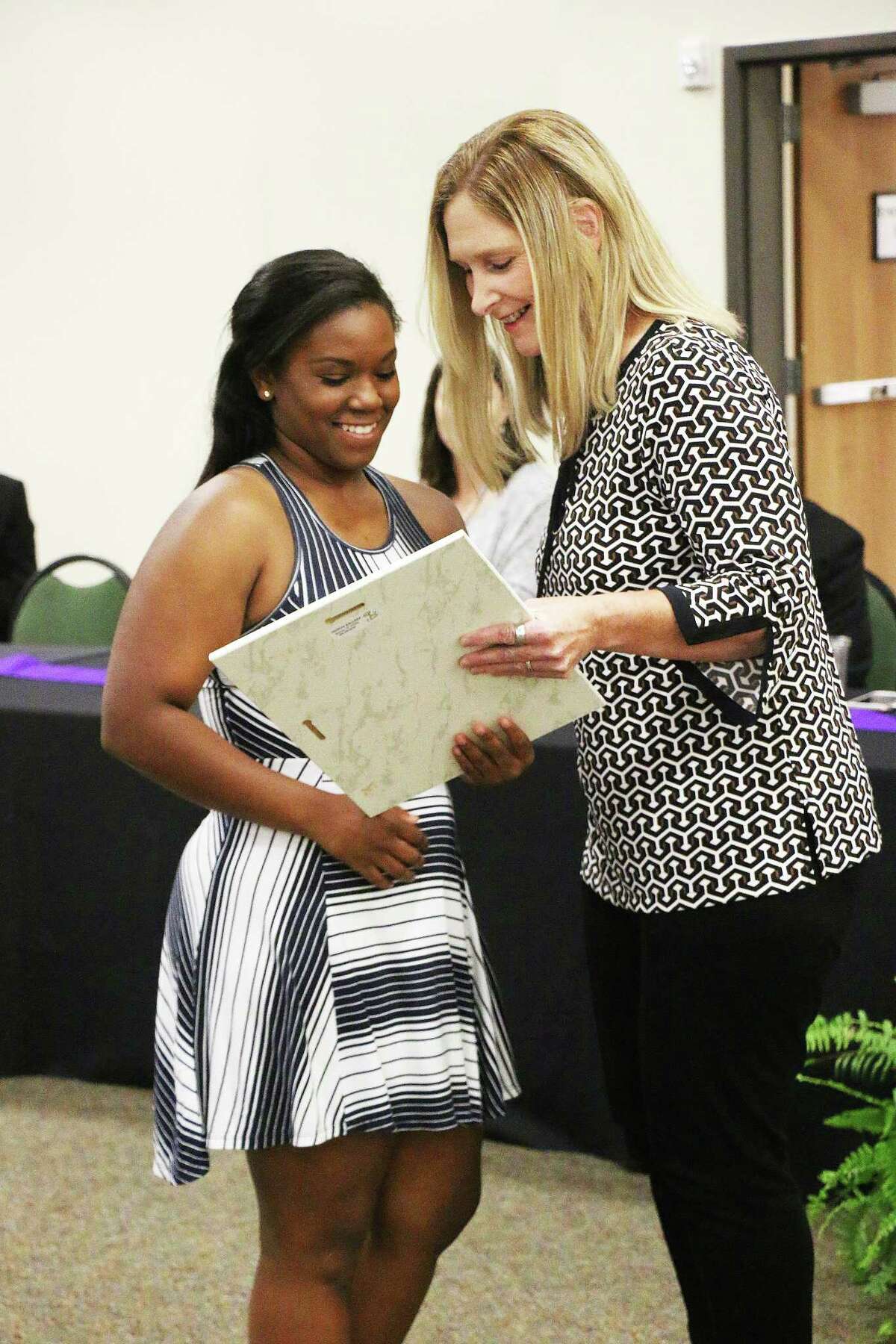 Jayla Pruitt accepts the award as the Dayton High School Female Athlete of the Year.
