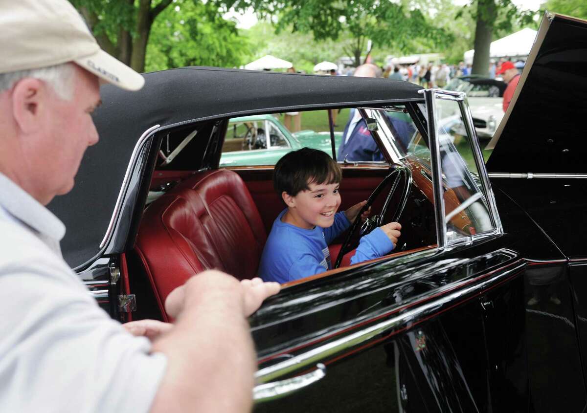 Winn Metrailler, 9, of Purchase, N.Y., sits inside a 1950 Rolls Royce Silver Wraith on day two of the 22nd Greenwich Concours d?’Elegance car show at Roger Sherman Baldwin Park in Greenwich, Conn. Sunday, June 4, 2017. The Sunday show featured imported cars including more than 20 Bugattis from the American Bugatti Club as well as racecars from the Lime Rock Historic Festival.