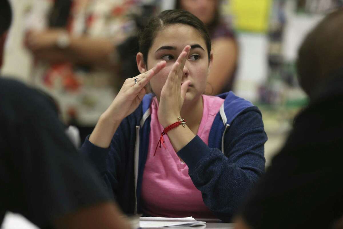 Liliana Garcia, 15, from Somerset ISD, participates in an English class at South San Antonio High School, Thursday, May 18, 2017. The South San Antonio ISD program for the deaf and hard of hearing is the hub for a dozen school districts in the southern region.
