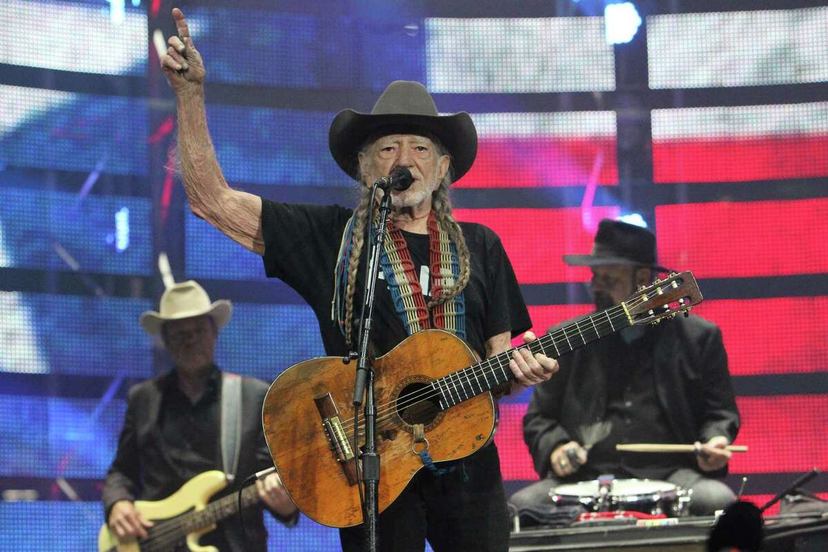 Willie Nelson and his guitar "Trigger" perform before a sold-out concert at RodeoHouston Saturday, March 18, 2017, in Houston. ( Steve Gonzales / Houston Chronicle )