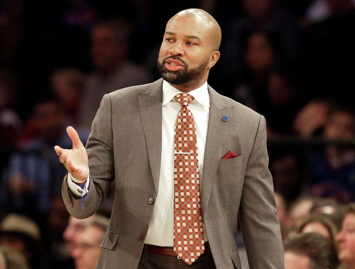 FILE - This Feb. 7, 2016 file photo shows then-New York Knicks head coach Derek Fisher looks at an NBA basketball game in New York. Authorities say Fisher has been arrested on suspicion of drunken driving after he flipped his vehicle on a California highway. The California Highway Patrol says neither Fisher nor his passenger, former "Basketball Wives" reality star Gloria Govan, were injured in the crash early Sunday, June 4, 2017. (AP Photo/Seth Wenig, File)