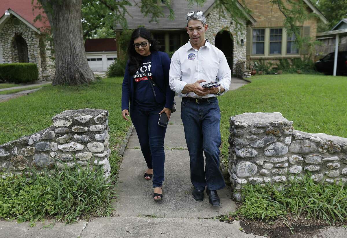 District 8 Councilman and mayoral candidate Ron Nirenberg along with Deputy Campaign Manager Juany Torres block walk in the neighborhood of Monticello Historic District on Saturday, June 3, 2017. Nirenberg is in a runoff for the Mayor's office against current city mayor Ivy Taylor. (Kin Man Hui/San Antonio Express-News)