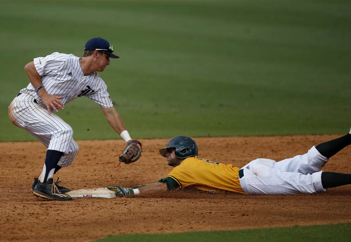 Southeastern Louisiana's Ryan Byers reaches second base but is called out stealing as Rice shortstop Ford Proctor covers in the fifth inning of an NCAA college baseball tournament regional game in Baton Rouge, La., Sunday, June 4, 2017. (AP Photo/Gerald Herbert)