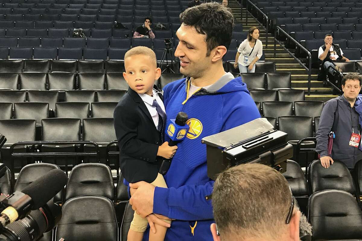 Young Trent Fuller, 4, with Zaza Pachulia at NBA Finals Media Day on Thursday, June 1. (Al Saracevic/San Francisco Chronicle)