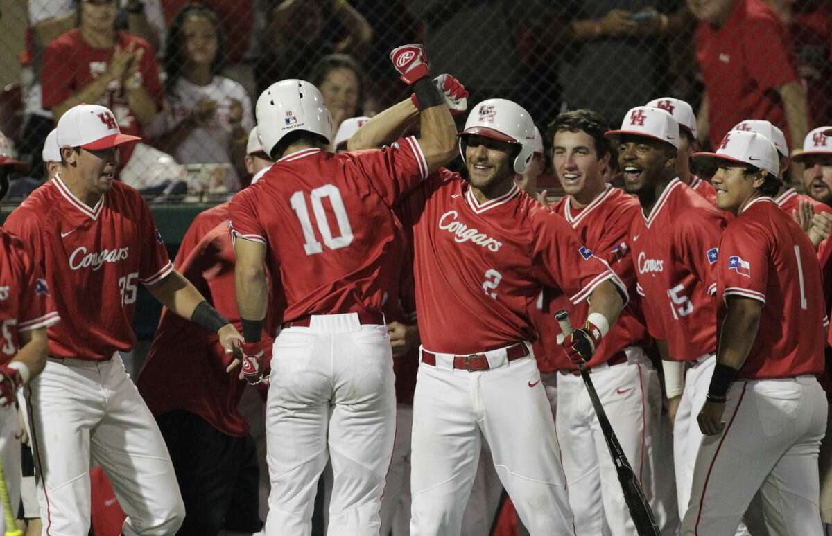 Houston catcher Connor Wong (10) celebrates his game-winning single home run with the Cougars dugout during the top ninth inning of the 2017 NCAA Regional Game 5 against Iowa at Darryl and Lori Schroeder Park Sunday, June 4, 2017, in Houston. Houston Cougars defeated Iowa Hawkeyes 7-5. ( Yi-Chin Lee / Houston Chronicle )