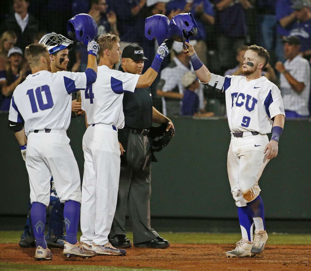 TCU catcher Evan Skoug (9) arrives at home plate after his 3-run home run in the eighth inning against Central Connecticut State during an NCAA college baseball regional on Saturday, June 3, 2017, in Fort Worth, Texas. (Paul Moseley/Star-Telegram via AP)