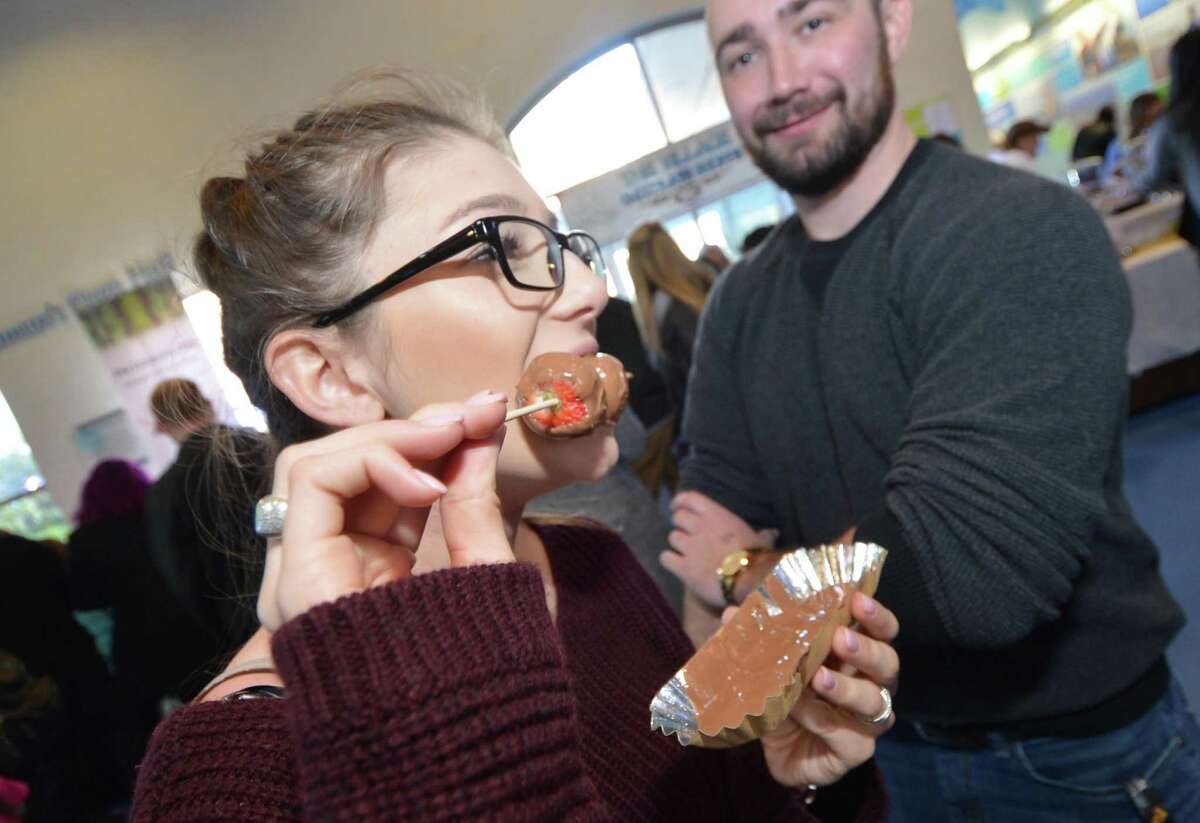 A guest nibbles an offering in January 2017 at the Chocolate Expo at the Maritime Aquarium in South Norwalk, Conn. On June 22, 2017, the aquarium hosts the “Maritime with a Twist” event featuring offerings of SoNo restaurants.