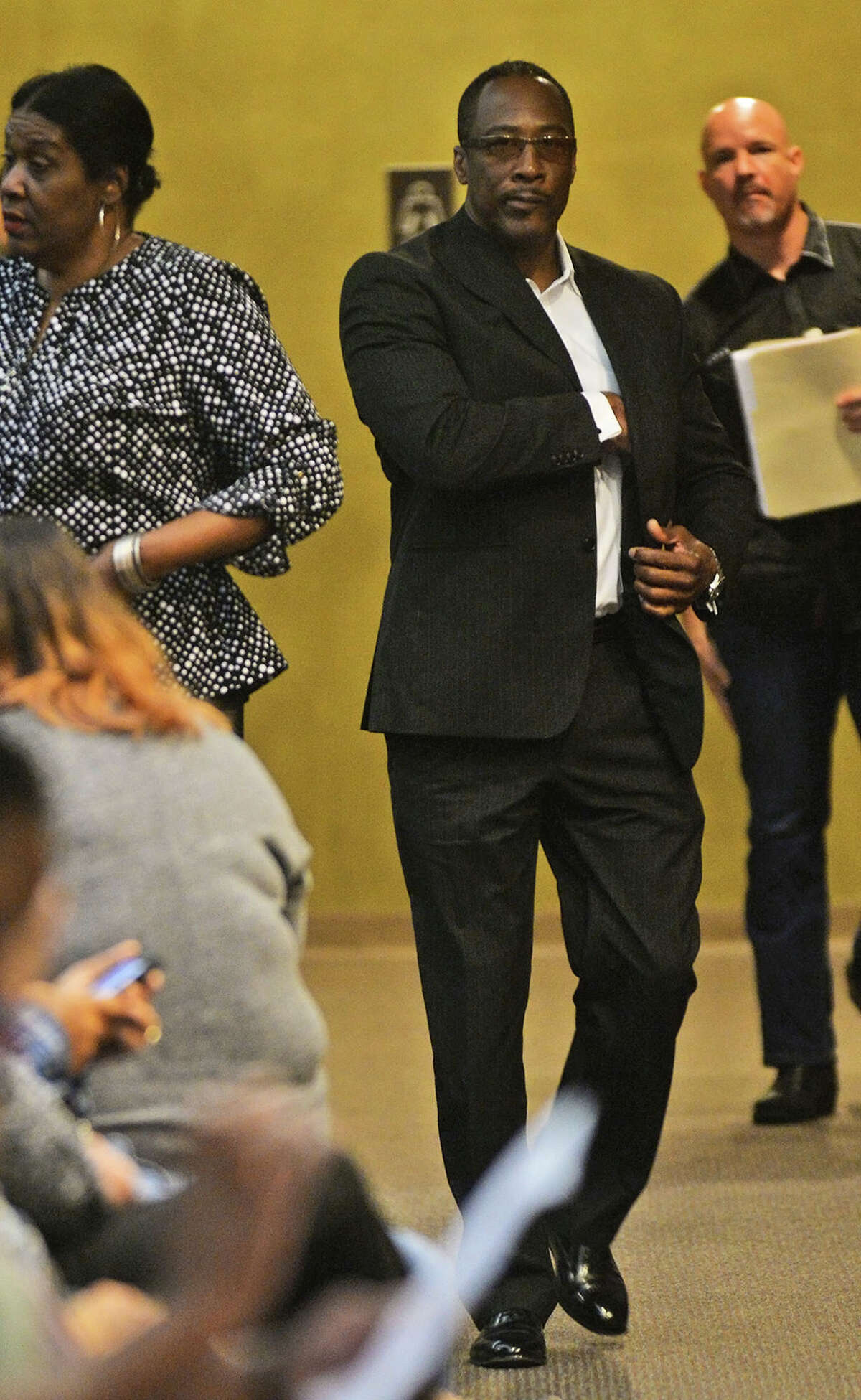 Calvin Walker walks through the Jefferson County Courthouse Monday before his his pre-trial hearing for a 2014 indictment of four counts of fraud and two counts of money-laundering. Photo taken Guiseppe Barranco Guiseppe Barranco/The Enterprise