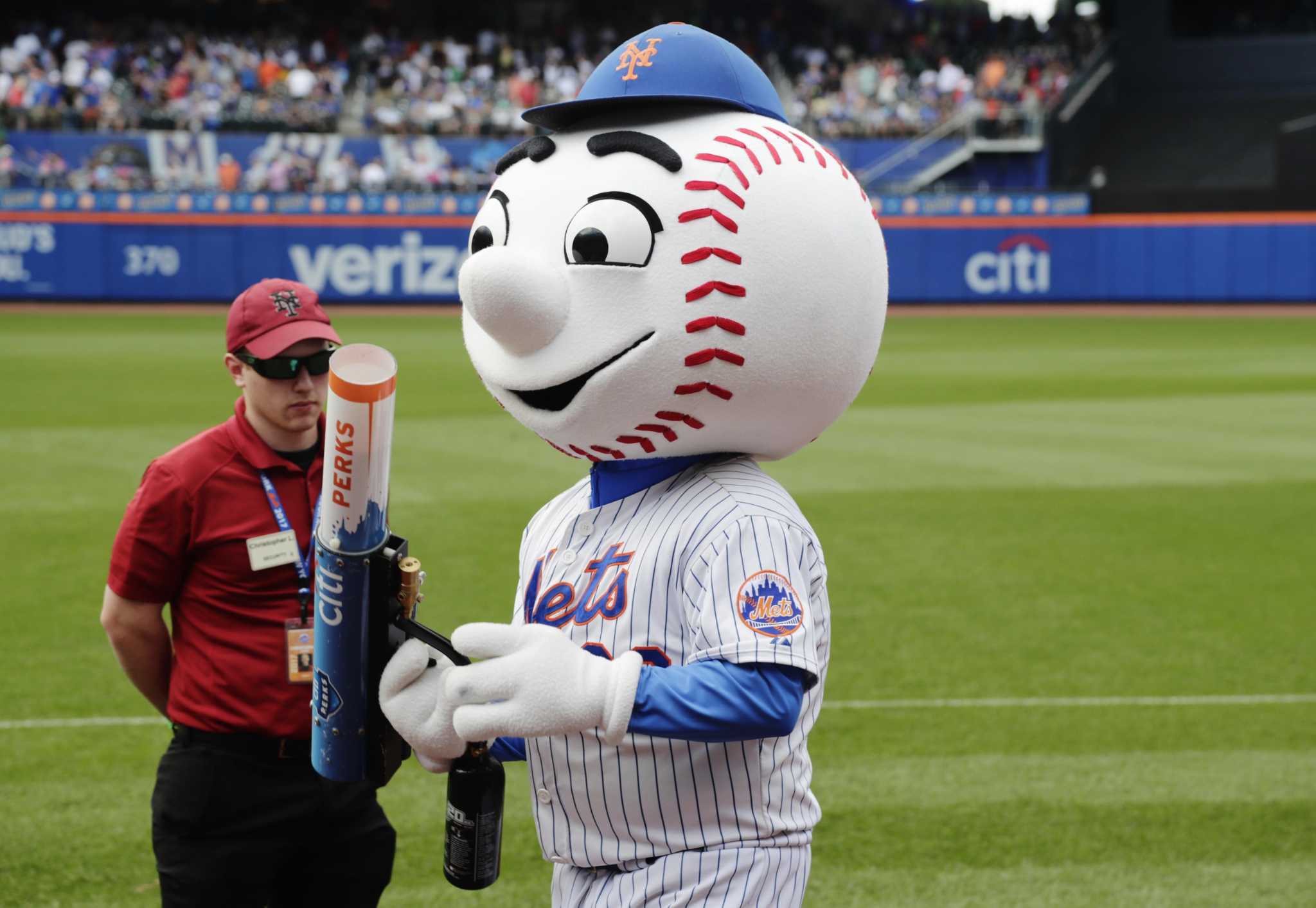 New York Mets mascots Mr. & Mrs. Met during the seventh inning