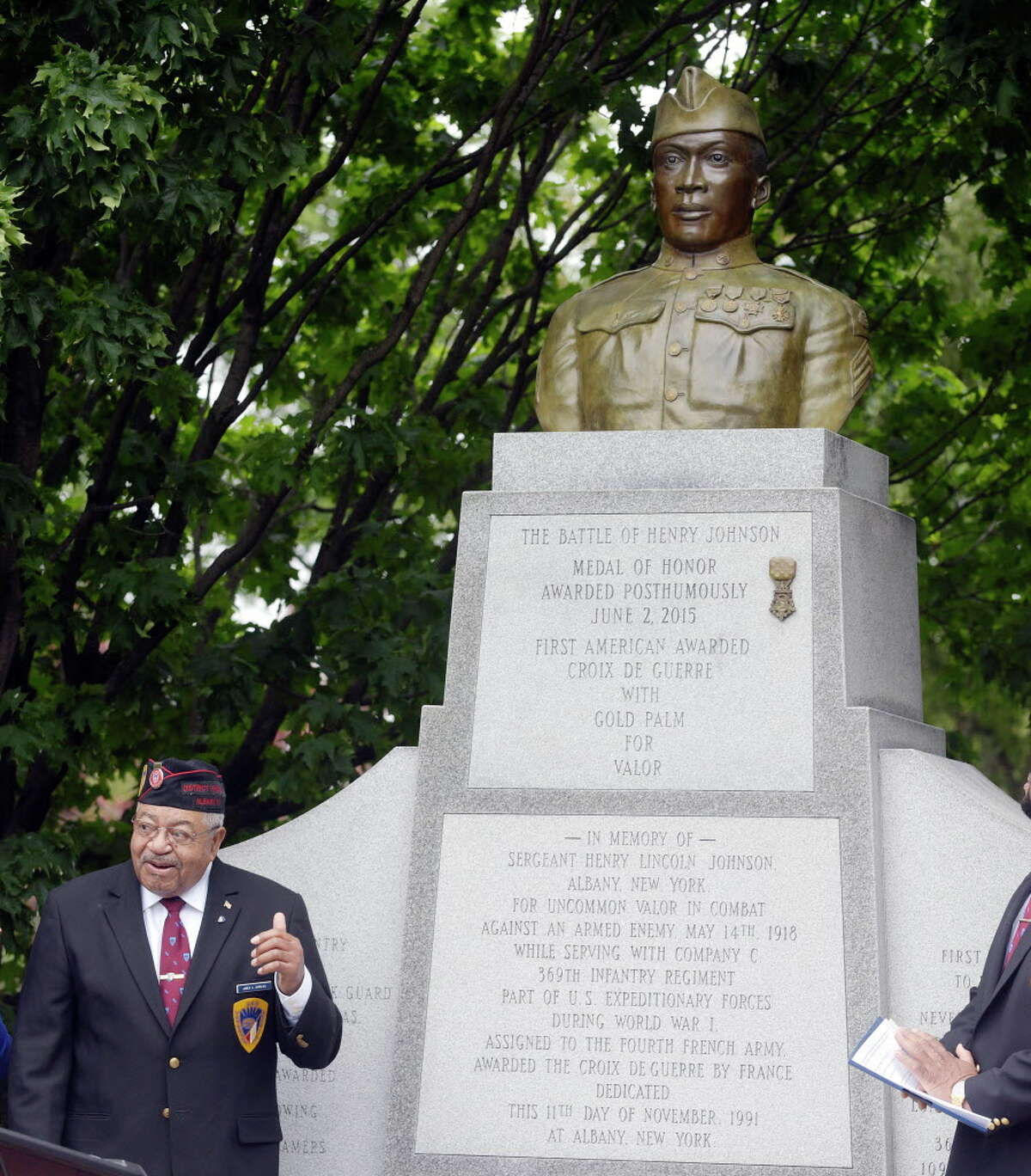 James Dandles, the district president of the 369th Veterans Association (Henry Johnson?•s Regiment) stands near the Henry Johnson statue at an event to mark the first annual Henry Johnson Day on Monday, June 5, 2017, in Albany, N.Y. A replica Medal of Honor was added to the Henry Johnson Statue, which was unveiled on Monday. Dandles was also awarded the first Henry Johnson Award for Distinguished Community Service. (Paul Buckowski / Times Union)