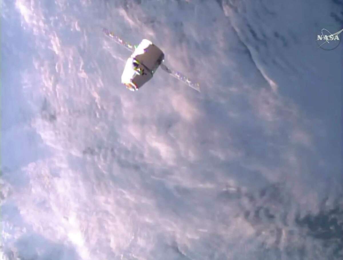 A SpaceX Dragon approaches the International Space Station on Monday, June 5, 2017, making an unprecedented second trip to the orbiting outpost. The Dragon supply ship, recycled following a 2014 flight, was launched from Florida on Saturday. (NASA TV via AP)