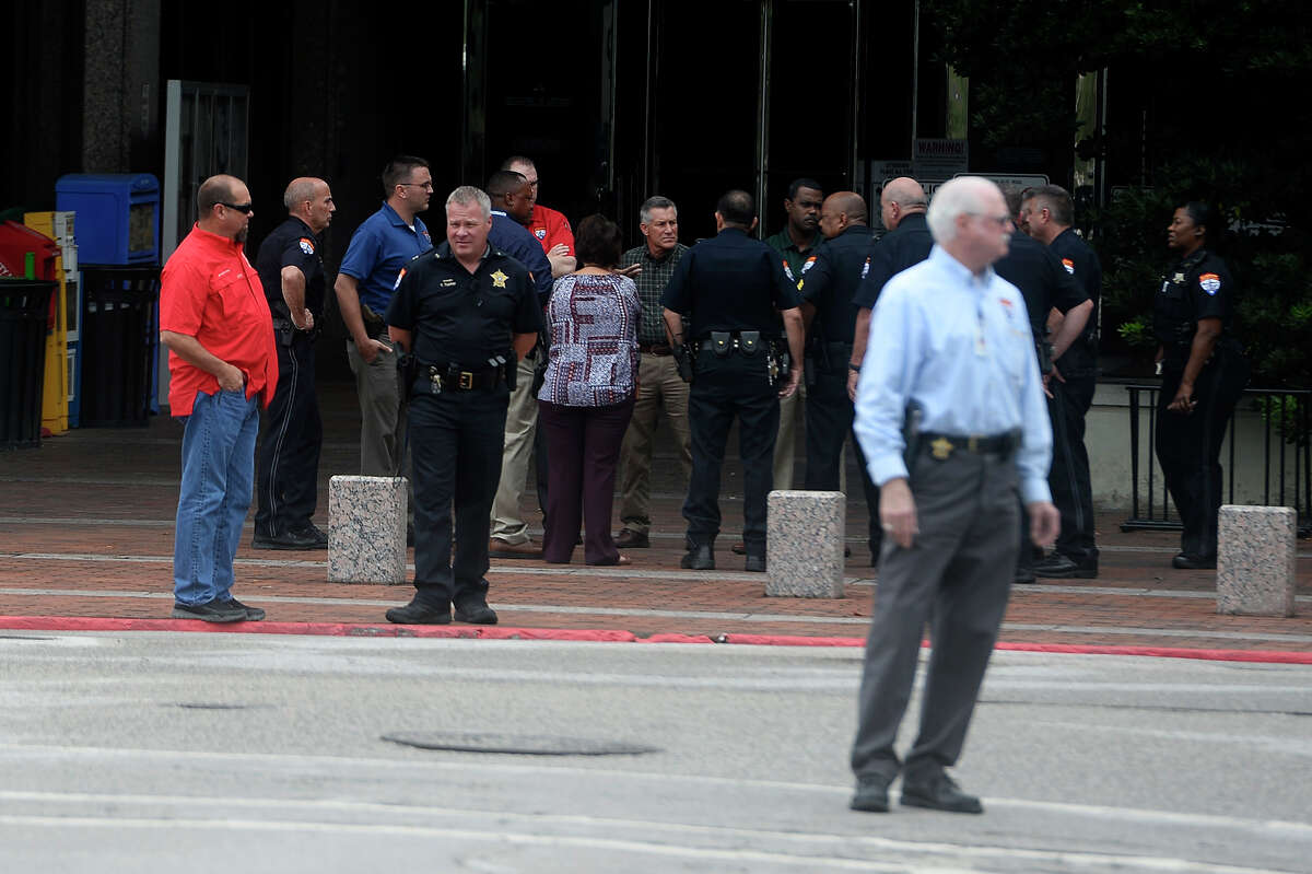 Law enforcement stand outside the entrance to the Jefferson County Courthouse after it was evacuated for a bomb threat on Monday. Photo taken Monday 6/5/17 Ryan Pelham/The Enterprise