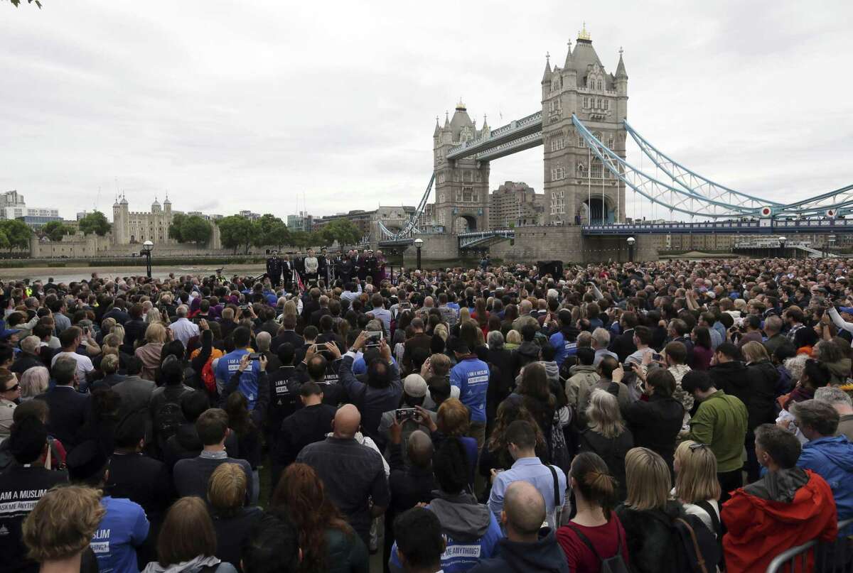 People attend a vigil for victims of Saturday's attack in London Bridge, at Potter's Field Park in London, Monday, June 5, 2017. Police arrested several people and are widening their investigation after a series of attacks described as terrorism killed several people and injured more than 40 others in the heart of London on Saturday.