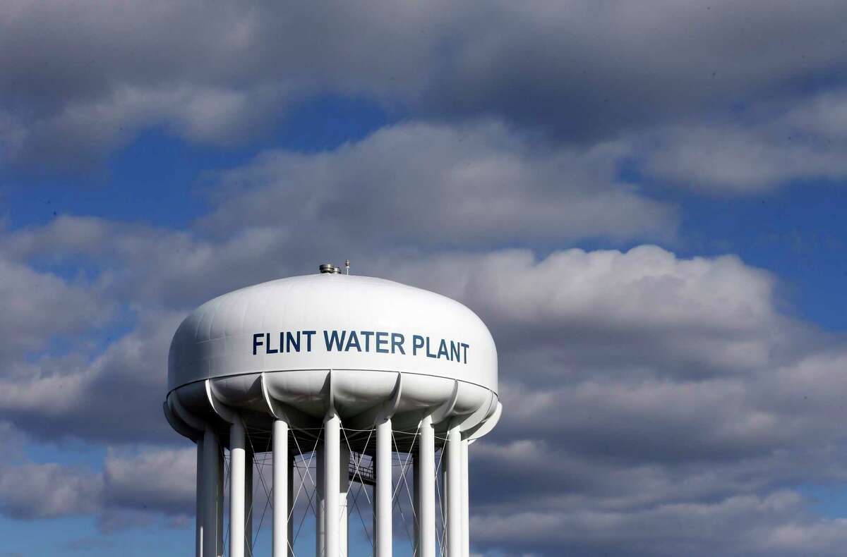 The Flint Water Plant water tower is seen in Flint, Mich. (AP Photo/Carlos Osorio, File)