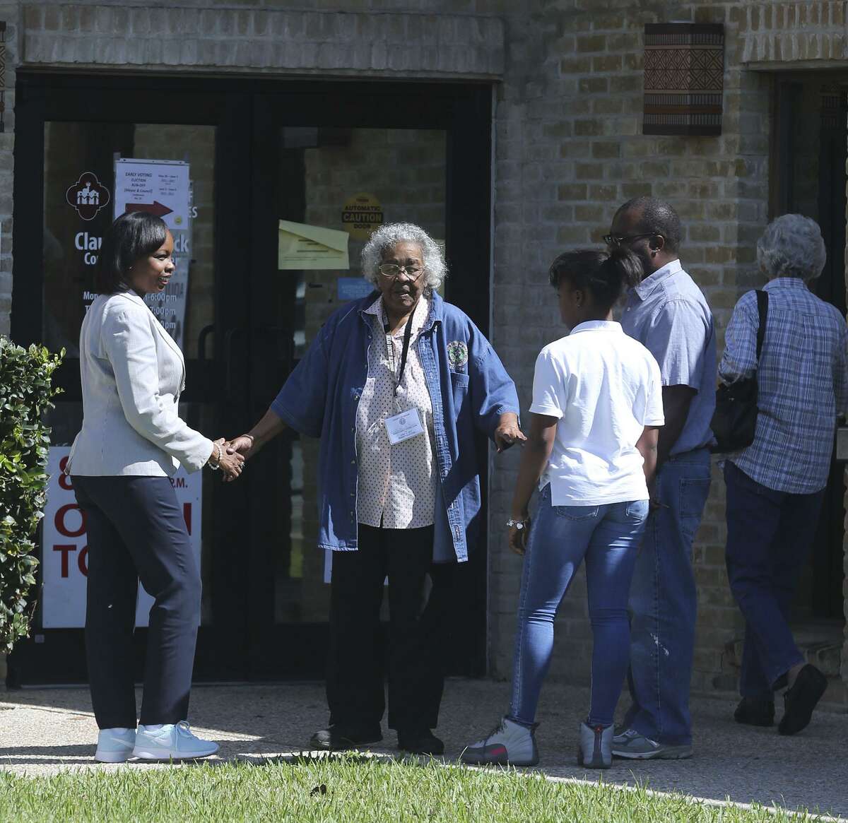 San Antonio mayor Ivy Taylor (left) enters the Claude Black Center Monday June 5, 2017 before casting her ballot during early voting. Taylor was accompanied by her daughter Morgan Taylor,13, and her husband Rodney Taylor. Taylor said she voted for herself.
