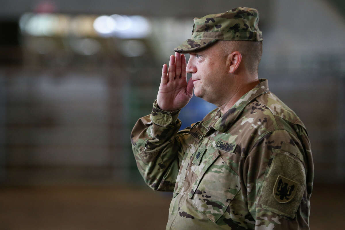 Lt. Col. Edmund Naughton salutes during the 1-158th Aviation Regiment's Change of Command and Change of Responsibility Ceremony on Sunday, June 4, 2017, at the Montgomery County Fairgrounds.