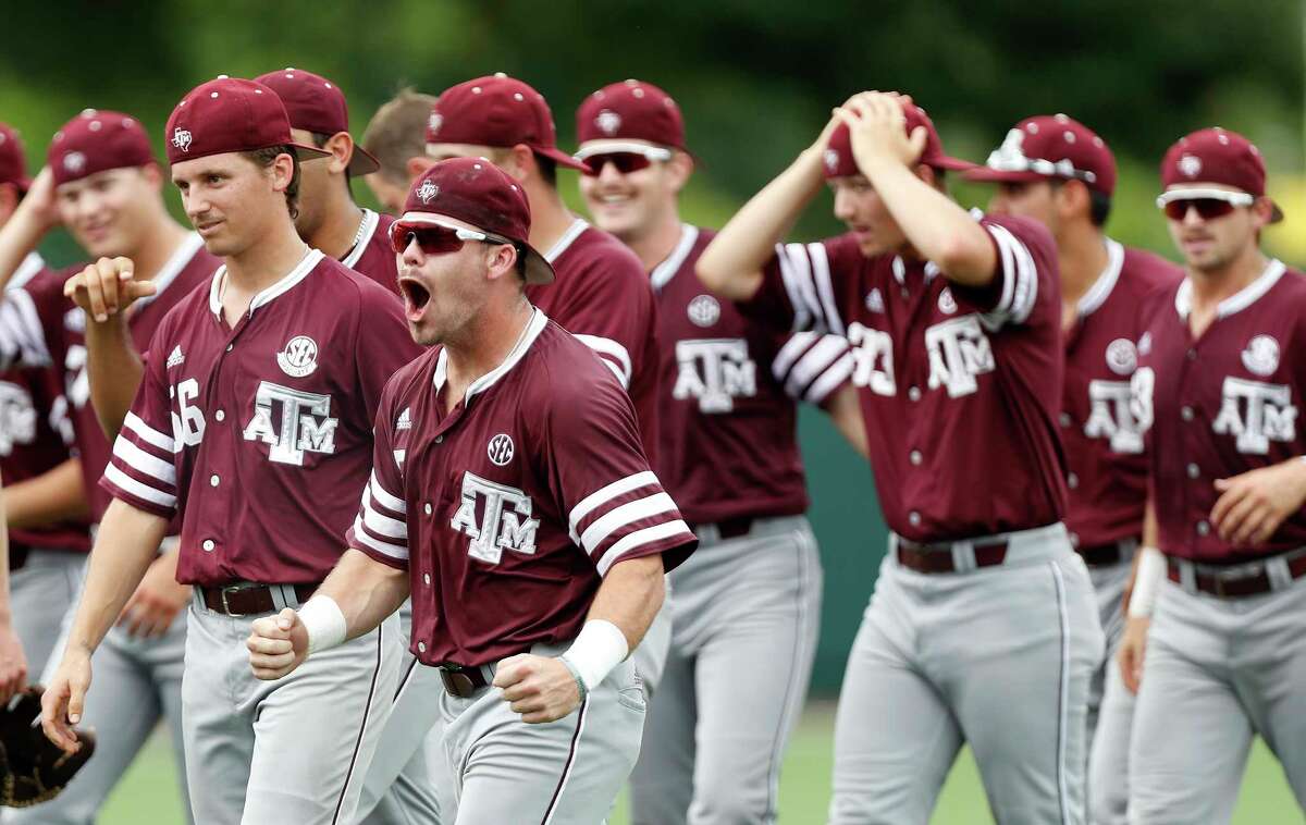Texas A&M's Logan Foster (5) celebrates with teammates after pulling out a 4-3 win over the Houston Cougars during Game 6 of an NCAA Regional baseball game at Schroeder Park, in Houston, Monday, June, 5, 2017. ( Karen Warren / Houston Chronicle )