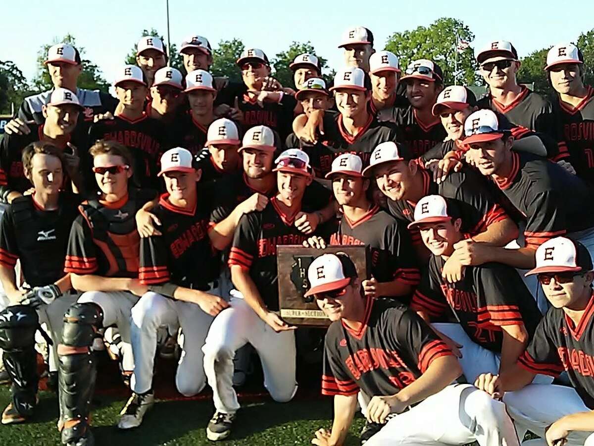The Edwardsville baseball team poses with the championship plaque on Monday after beating Orland Park Sandburg in the Class 4A University of Illinois Super-Sectional at Illini Field in Champaign.