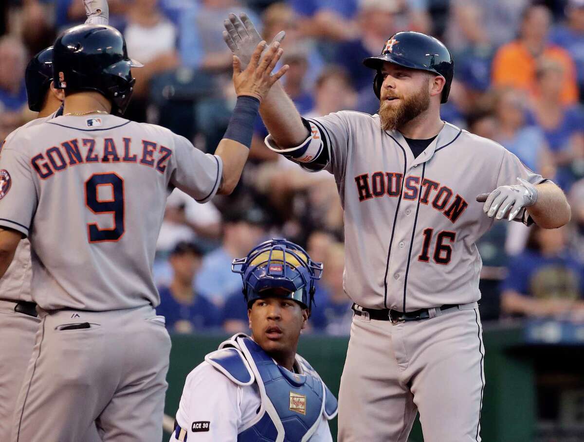 Houston Astros' Brian McCann (16) celebrates with Marwin Gonzalez (9) after hitting a two-run home run during the fourth inning of a baseball game against the Kansas City Royals, Monday, June 5, 2017, in Kansas City, Mo. (AP Photo/Charlie Riedel)