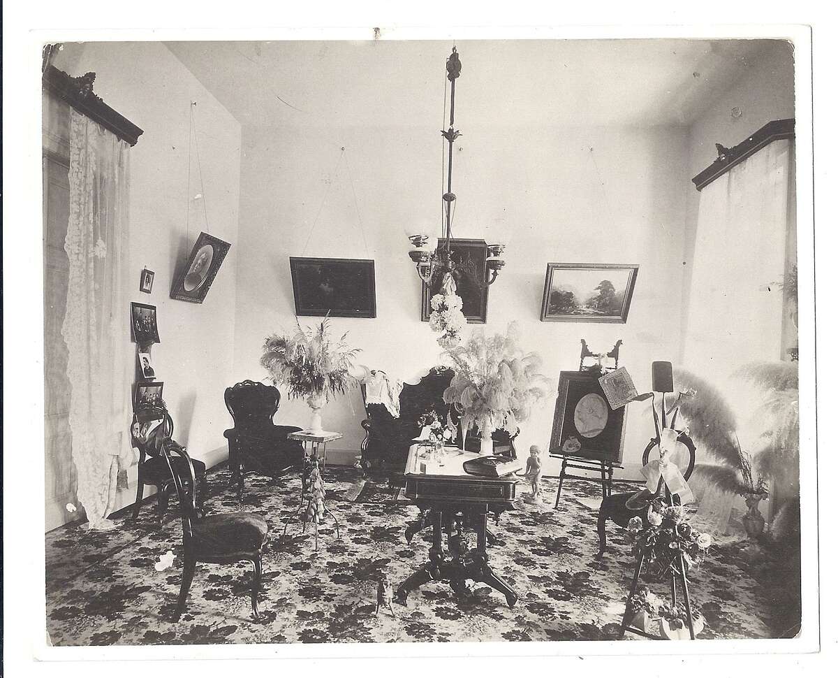 The parlor on the second floor of the Wulff House, taken during the late 19th century while the family of merchant Anton Wulff was in residence. This is the main floor of the San Antonio Conservation Society headquarters; the former parlor is now used as a conference room.