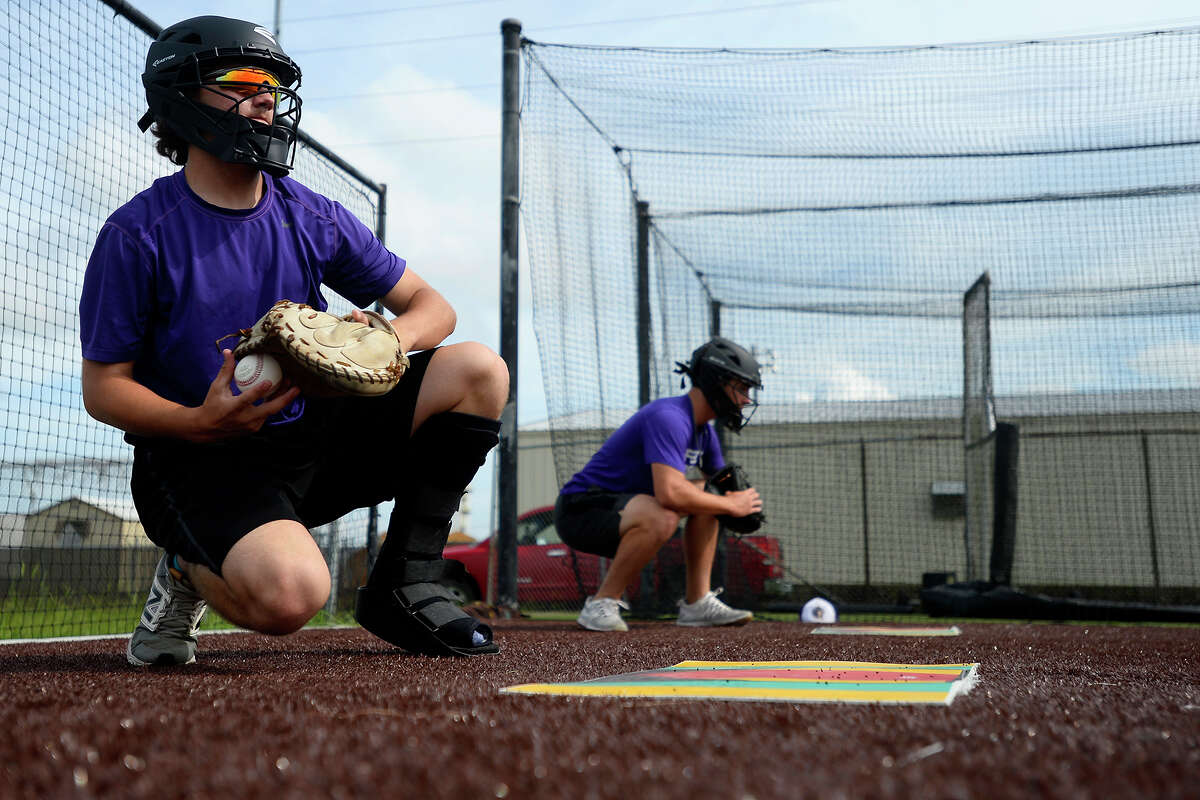 Port Neches-Groves catcher Braxton Boudoin catches in the bullpen during practice on Monday. The team will play in the state semi-finals on Thursday. Photo taken Monday 6/5/17 Ryan Pelham/The Enterprise