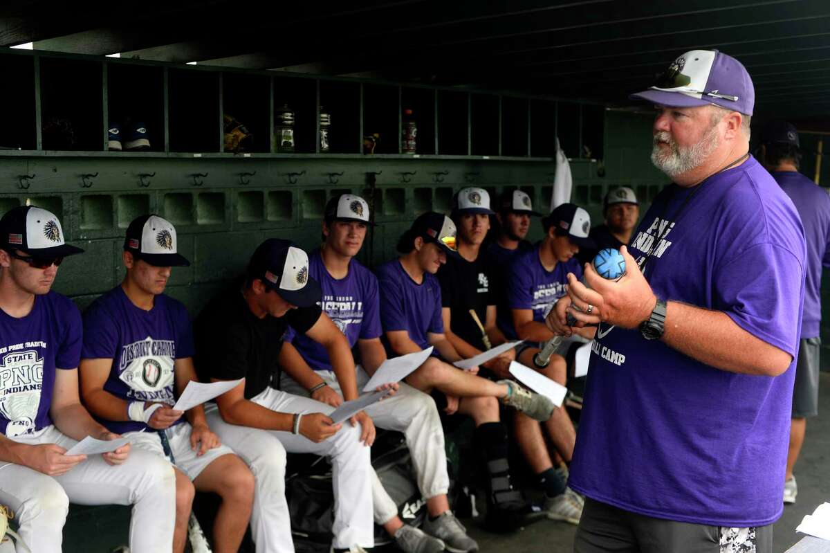 Port Neches-Groves baseball coach Scott Carter talks to the team during practice on Monday. The team will play in the state semi-finals on Thursday. Photo taken Monday 6/5/17 Ryan Pelham/The Enterprise