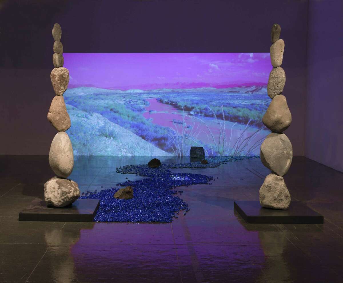 “Borderline Reality,” an installation by Sabine Senft, features a video backdrop of the Rio Grande and a “river” made of candy.