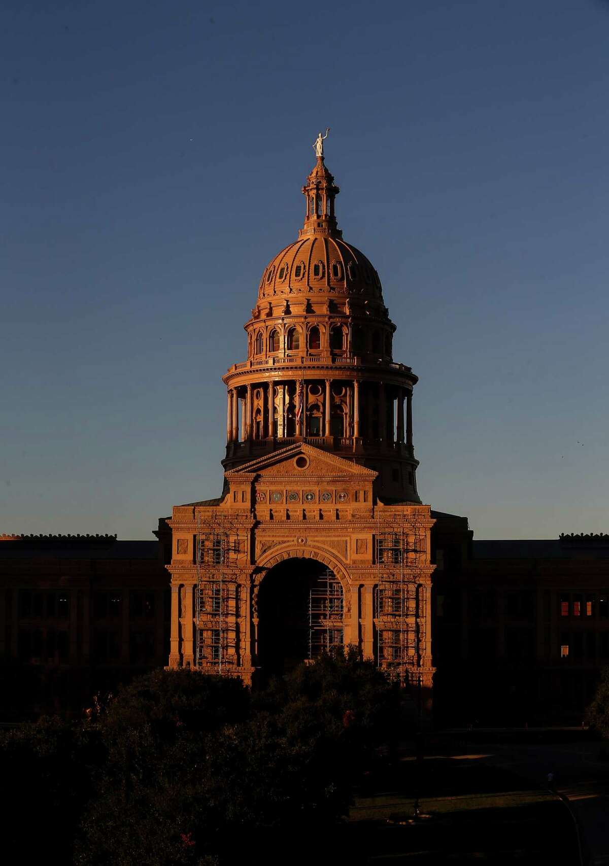 The sun sets over the Texas Capitol Friday, Oct. 21, 2016, in Austin. The House approved on second reading a "sunset" bill that would extend operations for five agencies that oversee medical personnel until 2019.  ( Jon Shapley / Houston Chronicle )