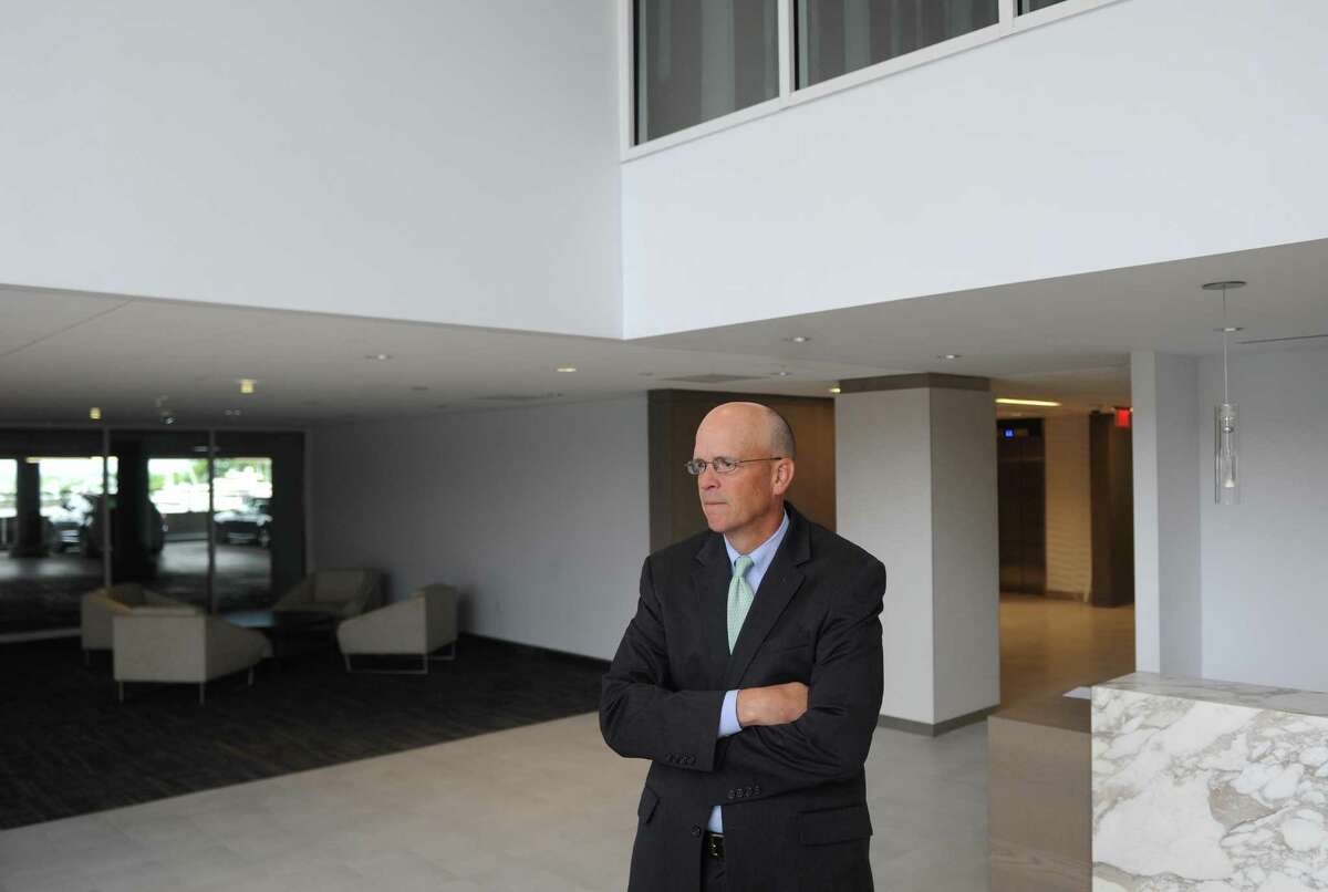 George Comfort & Sons SVP Dana Pike shows a building lobby at the Shippan Landing office park in Stamford, Conn. Tuesday, June 6, 2017. Much of the office space has been updated and renovated to enhance the waterfront views while adding many amenities like a cafeteria, gym and open conference rooms.