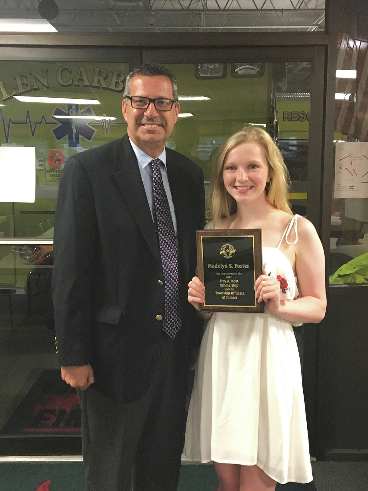 Scholarship recipient Madelyn Foster of Glen Carbon, right, is pictured recently with Edwardsville Township Supervisor Frank Miles.