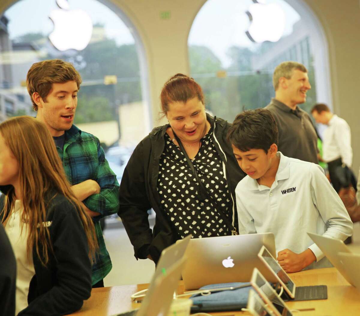 Whitby Upper School Math Teacher Joseph Budzelek, Primary Years Programme Coordinator Diana Ljepoja and sixth grader Aveer Pandey participated in a science expo at the Greenwich Apple Store Tuesday.