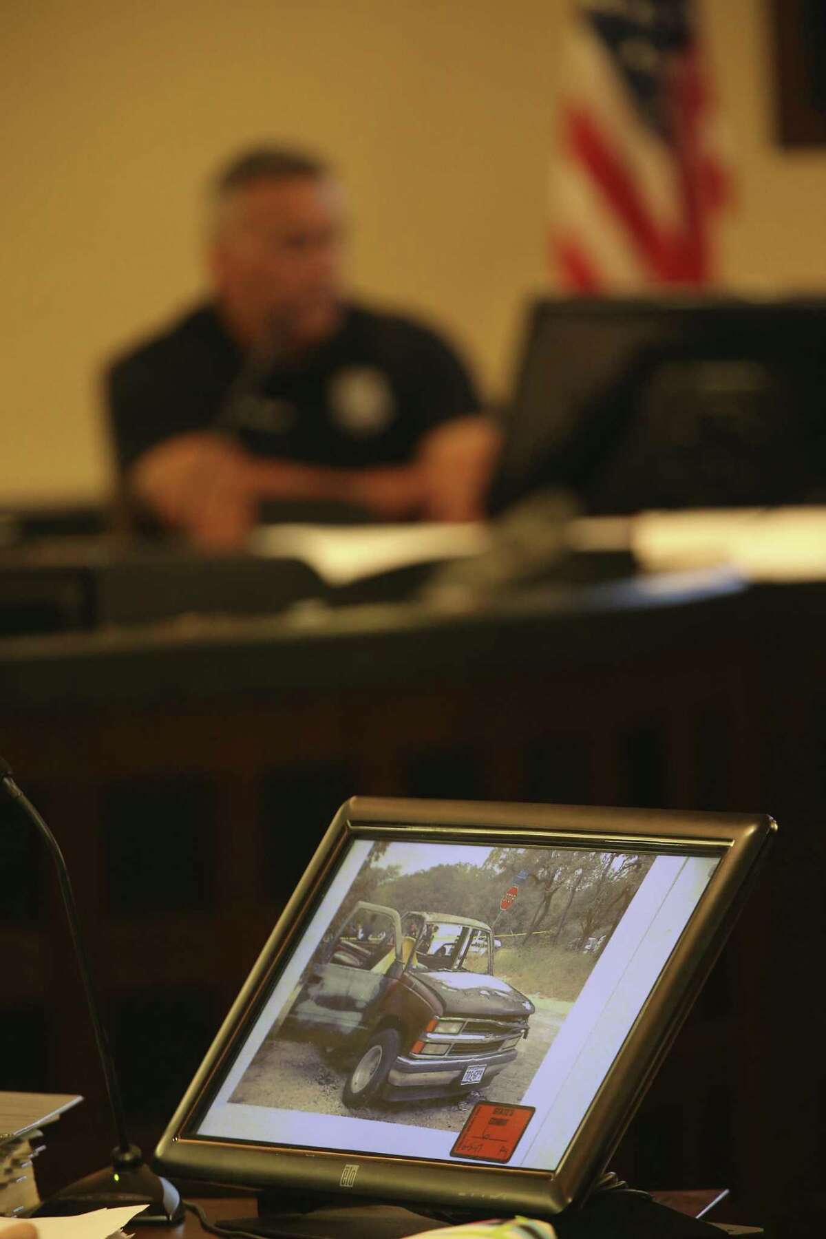 Photographs from the scene are introduced as evidence during the second day of the murder trial of Joel Soto on Tuesday in the Bexar County 379th Criminal District Court. Soto is accused in the November 2013 death of his 2-year-old grandson, Jeremy Soto. San Antonio Fire Department Arson Investigator Juan Martinez is on the witness stand.