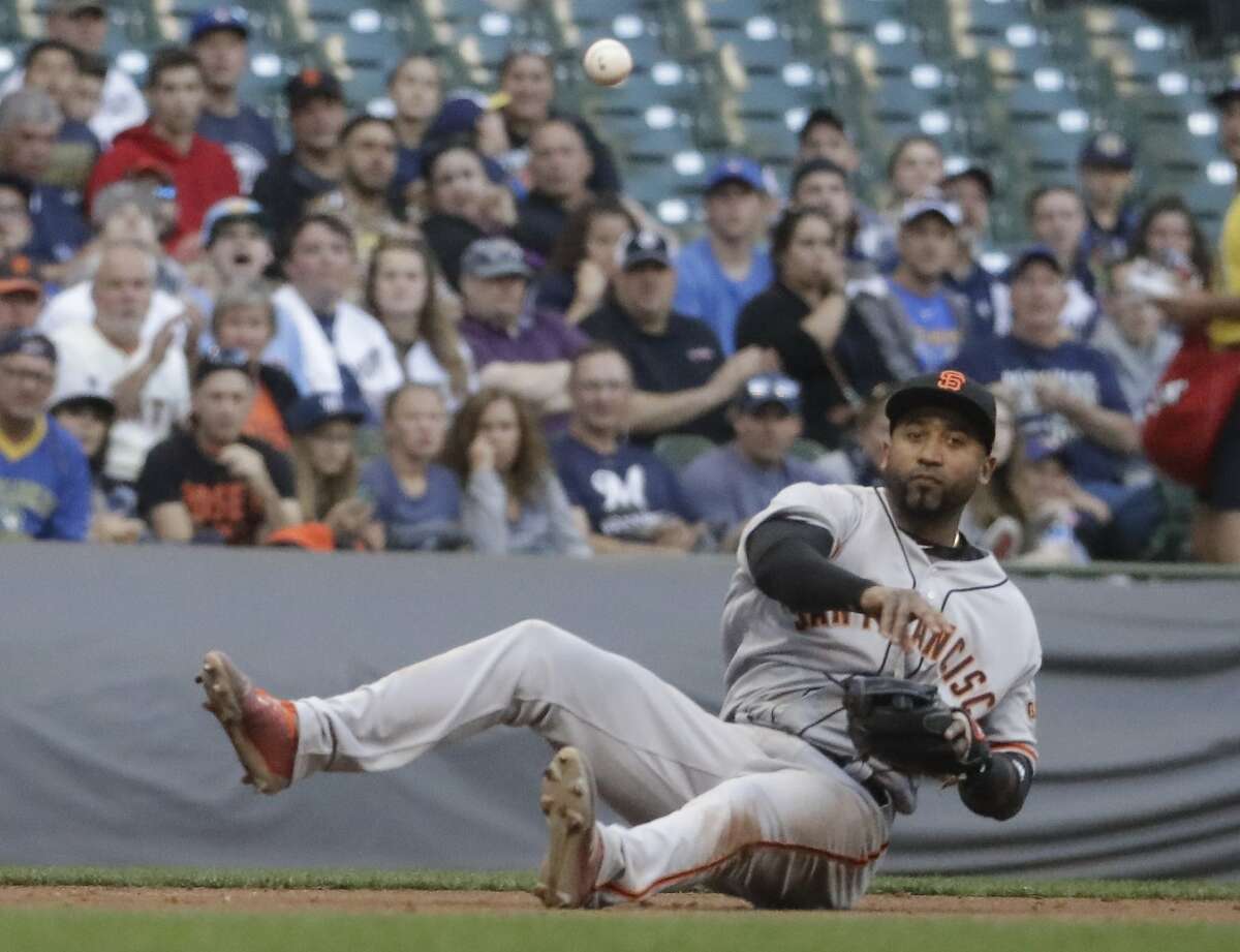 Former Giants' third baseman Eduardo Nunez throws out Milwaukee Brewers' Jett Bandy from the ground during the third inning of a baseball game Tuesday, June 6, 2017, in Milwaukee.